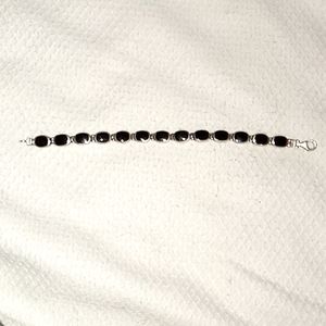 Sterling silver, black onyx, and mother of pearl tennis bracelet